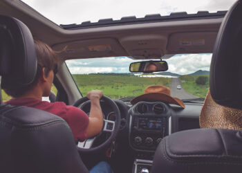 A picture of two people driving their car peacefully down the road because of their vehicle protection plan